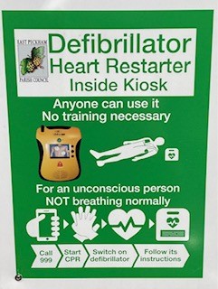 Defibrillator sign - Heart restarter inside kiosk. Anyone can use it. No training necessary